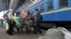 A file photo shows Ukrainian servicemen with relatives on a railway platform at a station in the western Ukrainian city of Lviv in January.