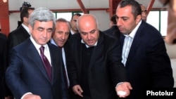 Armenia - President Serzh Sarkisian (L) visits a sugar refinery built by businessman Samvel Aleksanian (R).