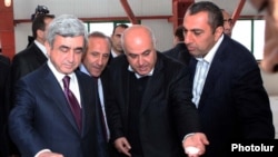 Armenia - President Serzh Sarkisian (L) visits a new sugar refinery built by businessman Samvel Aleksanian (R).