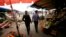 Russia -- Police officers walk through a market during a spot check of street markets and cafes in the Siberian city of Krasnoyarsk, August 7, 2013