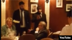 Video footage of the incident posted by the Kremlin-loyal website Lifenews shows two men approaching Mikhail Kasyanov at his table, one of whom violently slams a cake into his face while the other appears to film the attack.