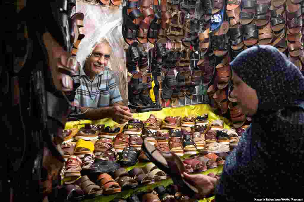 An Iranian woman buys shoes at a local bazaar in Bandar Abbas.&nbsp;