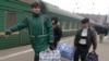 Migrant workers, such as these Tajiks in the Russian city of Vladivostok, will be the first to lose their jobs.