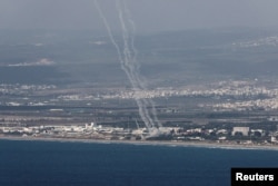 Sistemul israelian Iron Dome interceptând rachete lansate din la Haifa, în nordul Israelului, la 23 septembrie. Guvernul Israelului a cerut locuitorilor să aibă răbdare și să „rămână uniți”.