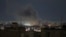 A plume of smoke rises from the site of an air strike in Tehran late on March 28.
