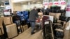 Russian Embassy staff arrive with their possessions at Vaclav Havel Airport in Prague following the expulsion of Russian diplomats from the Czech Republic in April. 