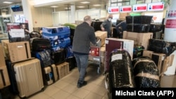 Russian Embassy staff arrive with their possessions at Vaclav Havel Airport in Prague following the expulsion of Russian diplomats from the Czech Republic in April. 