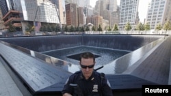 U.S. Port Authority officer provides security at the South Pool at the World Trade Center construction site in New York on September 9.