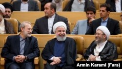 Iran -- Iranian Parliament speaker Ali Larijani (L), Iranian President Hassan Rouhani(C) and Sadeq Larijani Head of Iran's Judiciary. File photo