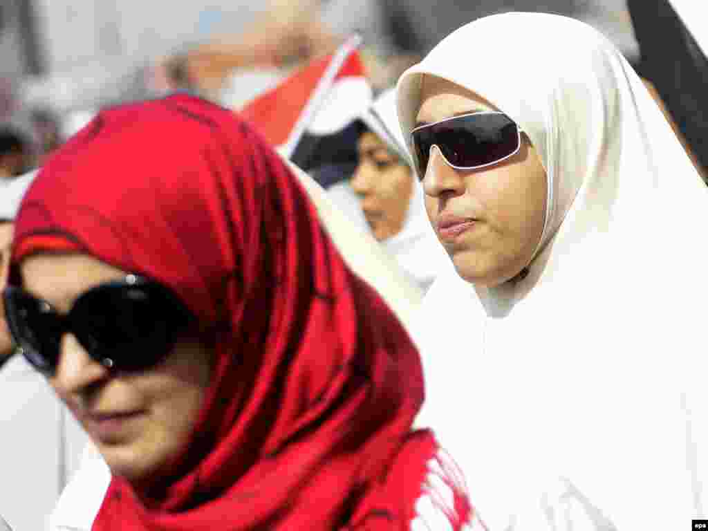 Women stand amid thousands of demonstrators during an antigovernment protest in Tahrir Square on February 8.