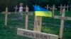 One hundred and seven wooden crosses were erected in the mock graveyard, in Prague&#39;s Vrsovice neighborhood, to commemorate those activists that have died in the Ukrainian unrest.