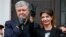 Former Ukrainian President Petro Poroshenko addresses supporters as his wife, Maryna, flashes the victory sign outside a court building in Kyiv on June 18.