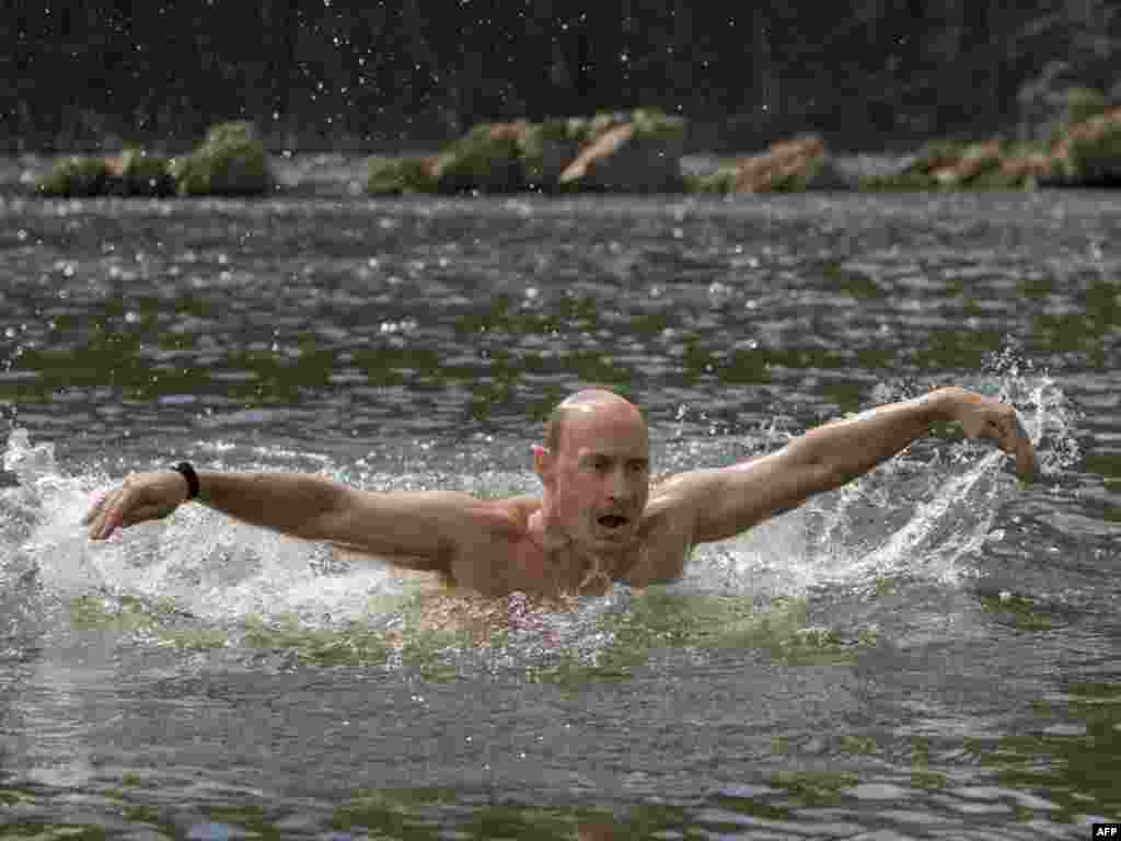 Russian Prime Minister Vladimir Putin does the butterfly stroke while vacationing outside the town of Kyzyl in southern Siberia on August 3.