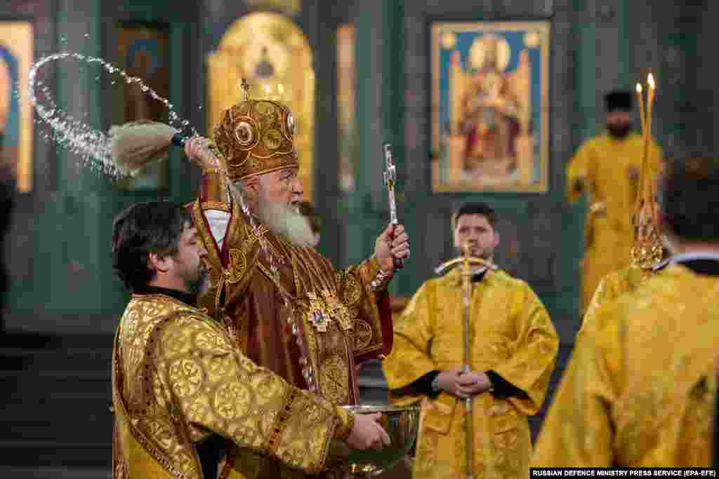 Patriarch Kirill (second left) leads the service at the cathedral.