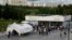 People wait in line at a vaccination center in a park in Moscow's outskirts on July 1.