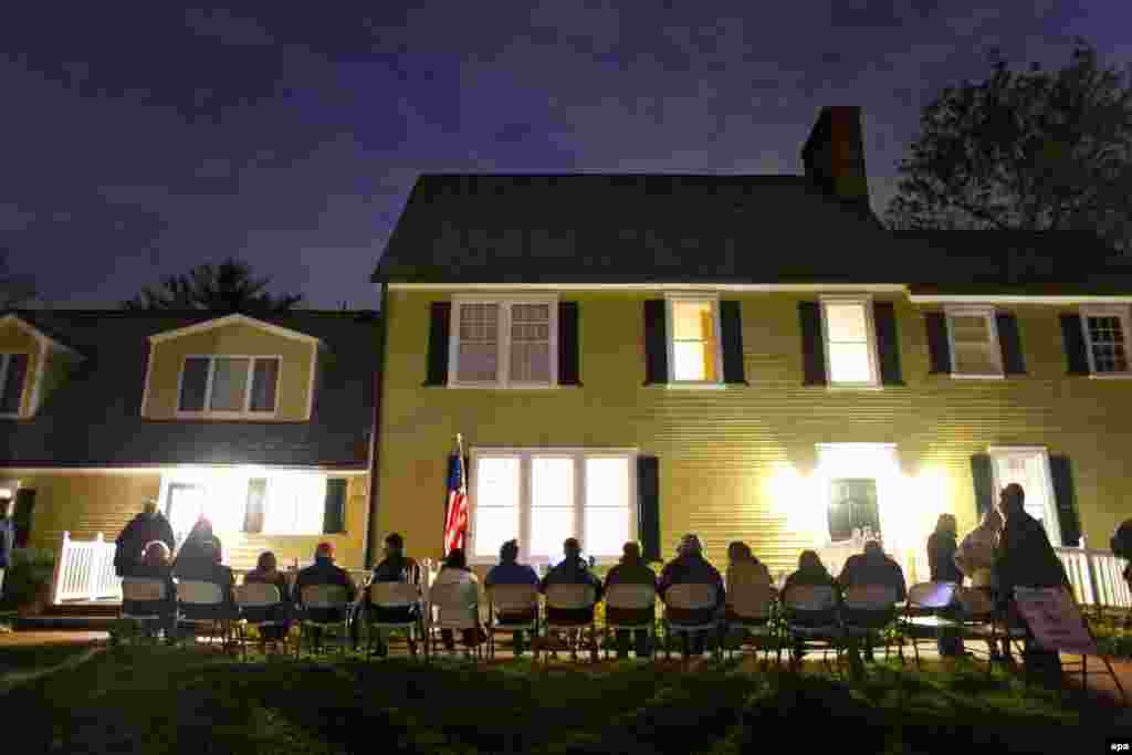 Virginia residents wait in line to vote at a historic property called the Hunter House in Vienna, Virginia.
