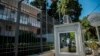 A photo taken on September 17 shows a broken window in a police booth in front of the Iranian Embassy in Athens.