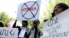 Armenia -- Young activists protest outside a Yerevan court during the trial of a school teacher accused of child sex abuse, 19May2010.