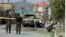 Security forces and medical workers attend the scene of a deadly bomb attack in Kabul in June. 