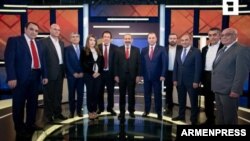 Armenia - The leaders of 11 parties and blocs running in parlamentary elections pose for a photograph before a live debate hosted by Armenian Public Television, December 5, 2018.