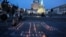 People lay candles in Kyiv to commemorate the deportation of the Crimean Tatars on May 18. 
