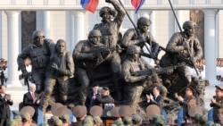 North Korean leader Kim Jong Un greets Russian officials earlier this year at a memorial in Pyongyang honoring North Korean soldiers who fought in Russia.