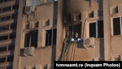 A firefighter in the window of the intensive care unit at the hospital in Piatra Neamt.