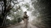 Ukrainian serviceman installs anti-drone nets over a road in the frontline town of Kostiantynivka
