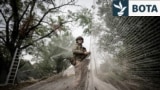 Ukrainian serviceman installs anti-drone nets over a road in the frontline town of Kostiantynivka