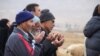 Residents of Qaen pray together for rain in the deserts around the Iranian city. 