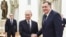 Bosnian Serb leader Milorad Dodik (right) is greeted by Russian President Vladimir Putin in Moscow on April 1. 