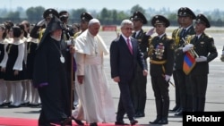 Armenia - President Serzh Sarkisian and Catholicos Garegin II greet Pope Francis on his arrival at Yerevan airport, 24Jun2016