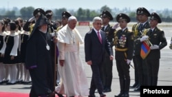 Armenia - President Serzh Sarkisian and Catholicos Garegin II greet Pope Francis on his arrival at Yerevan airport, 24Jun2016