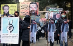 Afghans protest the release of Taliban prisoners in November 2019 in Kabul.