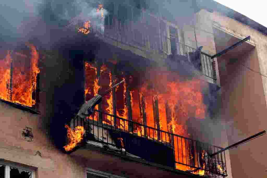 An apartment building burns after it was struck with a Russian bomb in Gori on August 9.