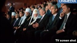 Russian Patriarch Kirill (fourth from right) speaks with Moldovan President Nicolae Timofte during his visit to Chisinau.