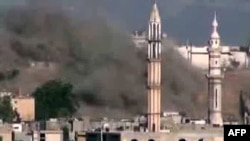 A video shows smoke billowing from a mosque in the Talbeesa neighborhood of the restive central city of Homs of July 2.