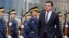 Newly elected Prime Minister Albin Kurti reviews Kosovo's honor guard during the handover ceremony in Pristina on February 4.