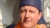 India -- British Prime Minister David Cameron looks on while visiting the Sikh Shrine Golden temple in Amritsar, 20Feb2013