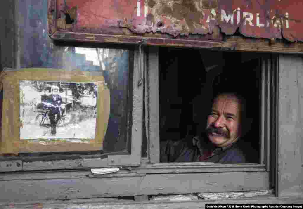 Photographer Gultekin Alkurt of Turkey: My Childhood This man lives in Istanbul, at Karakoy, in a tiny cabin left to him by his father. He can still smile despite the restricted living conditions.