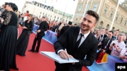 Russia's Sergei Lazarev poses on the red carpet during the official opening ceremony for the 61st annual Eurovision Song Contest.