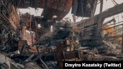 A Ukrainian soldier stands inside the ruined Azovstal steel plant in Mariupol on May 16.