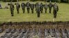 German soldiers salute during the reburial ceremony of the remains of German WWII soldiers at the German cemetery in Sologubovka outside St. Petersburg in September 2017. 