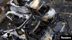 Charred remains of ambulances belonging to Hatzola, a Jewish community organization, which were set on fire in an incident that police say is being treated as an antisemitic hate crime, in London, on March 23