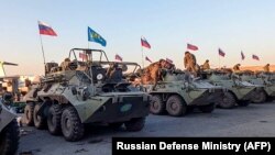 Russian military vehicles sent to monitor the truce in Nagorno-Karabakh are parked on the airfield in Yerevan on November 12.