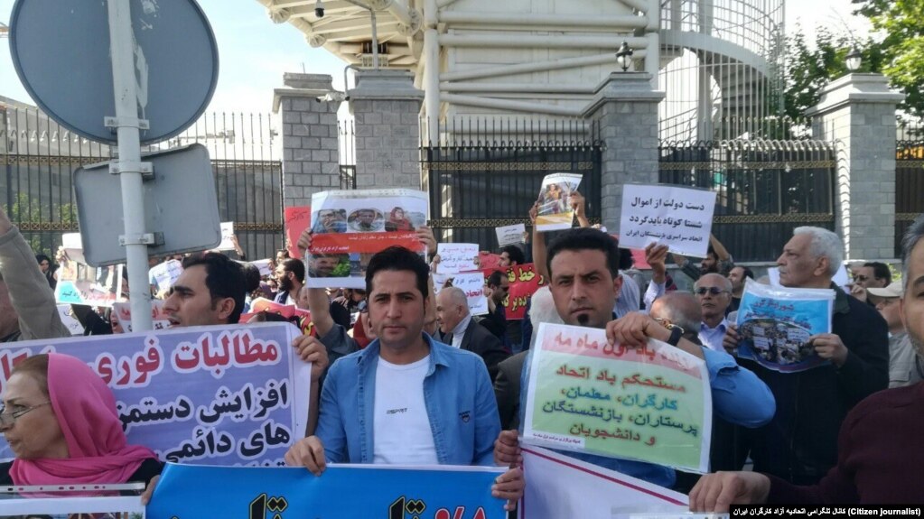Workers in Tehran gather to start their protest at the Iranian parliament before security forces attacked the protesters. May 1, 2019