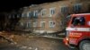 A view shows a fire truck next to a building damaged following a bomb blast at a hospital in Velykiy Burluk, Kharkiv region, Ukraine, on February 1. 