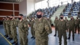 KOSOVO -- Kosovo Security Force (KSF) members wearing protective face masks line up during a peacekeeping mission deployment ceremony held at the army barracks in Pristina, March 9, 2021 