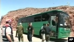 A TV grab shows a damaged Israeli passenger bus after it was attacked near the Egyptian border on August 18.