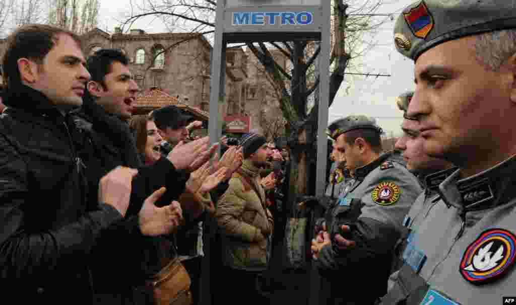 Armenian opposition supporters rally against President Serzh Sarkisian's election victory in front of his residence in Yerevan. (AFP/Karen Minasyan)
